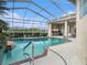 Inviting pool area with screened enclosure, spa, and outdoor kitchen at 331 Lewis Rd, Lithia, FL 33547