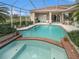 Relaxing pool and spa with brick coping and screened enclosure at 331 Lewis Rd, Lithia, FL 33547