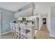 Kitchen with breakfast bar, white cabinets, and stainless steel appliances at 1013 Apollo Beach Blvd # 202, Apollo Beach, FL 33572