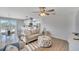 Living room with light beige sofa and adjacent dining area at 1013 Apollo Beach Blvd # 202, Apollo Beach, FL 33572