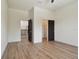 Bright bedroom featuring hardwood floors and two closets at 4327 Glendon Pl, Valrico, FL 33596