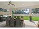 Enjoy outdoor dining with a built-in grill and views of the lush backyard at 4327 Glendon Pl, Valrico, FL 33596