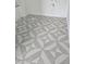 Grey and white patterned bathroom flooring with geometric design at 430 Columbia Dr, Tampa, FL 33606