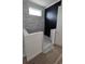 A modern bathroom features white and black tiled shower and floors at 430 Columbia Dr, Tampa, FL 33606