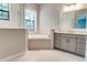 Spa-like bathroom with soaking tub, shower, and grey vanity at 430 Columbia Dr, Tampa, FL 33606