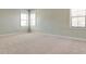 Spacious bedroom with neutral-colored carpeting and large windows at 430 Columbia Dr, Tampa, FL 33606