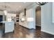 Modern kitchen with white cabinets, stainless steel appliances, and dark hardwood floors at 430 Columbia Dr, Tampa, FL 33606