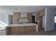 Bright kitchen featuring a marble island, white countertops and custom wood cabinetry at 430 Columbia Dr, Tampa, FL 33606