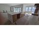 Spacious kitchen featuring a marble island, white countertops and stainless steel appliances at 430 Columbia Dr, Tampa, FL 33606