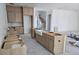 Modern kitchen featuring a farmhouse sink and staircase view at 430 Columbia Dr, Tampa, FL 33606