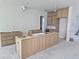 New kitchen with light wood cabinets and large island at 430 Columbia Dr, Tampa, FL 33606