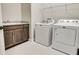 Convenient laundry room with washer, dryer, and built-in cabinetry at 430 Columbia Dr, Tampa, FL 33606