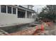 Unfinished pool area with concrete and temporary fencing at 430 Columbia Dr, Tampa, FL 33606