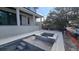 New construction features a pool and separate spa with tiled border and concrete surround at 430 Columbia Dr, Tampa, FL 33606