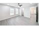 Bedroom with two windows, ceiling fan, and access to bathroom at 206 S Water St, Plant City, FL 33563
