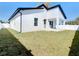 Single story house with a backyard and white vinyl fence at 206 S Water St, Plant City, FL 33563