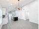 Spacious kitchen featuring a large island, stainless steel appliances, and stylish lighting at 206 S Water St, Plant City, FL 33563