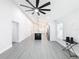 Open concept living room and kitchen area with gray vinyl flooring at 206 S Water St, Plant City, FL 33563