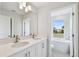 Double vanity bathroom with a soaking tub and window at 2607 N 21St St, Tampa, FL 33605