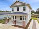 Two-story craftsman home with brick accents and a covered porch at 2607 N 21St St, Tampa, FL 33605