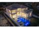 Luxury home aerial view showcasing a stunning pool at night at 5032 W Longfellow Ave, Tampa, FL 33629