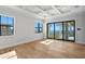 Spacious bedroom with hardwood floors, large windows, and water views at 5032 W Longfellow Ave, Tampa, FL 33629