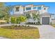 Stunning waterfront home with two-car garage and lush landscaping at 5032 W Longfellow Ave, Tampa, FL 33629