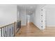 Long hallway with light hardwood floors and an open feel at 5032 W Longfellow Ave, Tampa, FL 33629