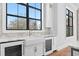 Modern kitchen with farmhouse sink and wine cooler at 5032 W Longfellow Ave, Tampa, FL 33629