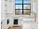Bright kitchen boasts a farmhouse sink and large window at 5032 W Longfellow Ave, Tampa, FL 33629