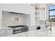 Modern kitchen with stainless steel appliances and marble countertops at 5032 W Longfellow Ave, Tampa, FL 33629