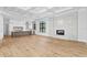 Living area with hardwood floors, fireplace, and kitchen views at 5032 W Longfellow Ave, Tampa, FL 33629