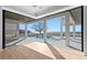 Open living space with pool and water views, hardwood floors and fireplace at 5032 W Longfellow Ave, Tampa, FL 33629