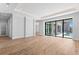 Bright and airy living room with hardwood floors and sliding doors leading to the pool area at 5032 W Longfellow Ave, Tampa, FL 33629