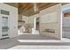 Outdoor kitchen with stainless steel appliances and a fireplace at 5032 W Longfellow Ave, Tampa, FL 33629