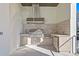 Stainless steel appliances and built in outdoor kitchen at 5032 W Longfellow Ave, Tampa, FL 33629