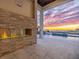 Outdoor patio with fireplace and sunset view at 5032 W Longfellow Ave, Tampa, FL 33629