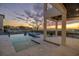 Outdoor patio with fireplace and sunset view at 5032 W Longfellow Ave, Tampa, FL 33629