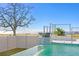 Relaxing pool with water feature and waterfront view at 5032 W Longfellow Ave, Tampa, FL 33629