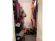 Full walk-in closet that offers ample space for storage of clothing, purses, and shoes at 6010 Laketree Ln # L, Temple Terrace, FL 33617