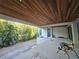 Covered patio with wood ceiling and lush landscaping at 107 Martinique Ave, Tampa, FL 33606