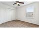 Simple bedroom with carpet, double-door closet and window with blinds at 605 19Th Nw St, Ruskin, FL 33570