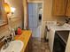 Bathroom with vanity and access to laundry area at 1006 39Th W Ave, Bradenton, FL 34205