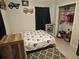 bedroom with Minnie Mouse bedding and walk-in closet at 1006 39Th W Ave, Bradenton, FL 34205