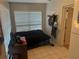 Bright bedroom with white tile floors, natural light, and neutral paint at 1006 39Th W Ave, Bradenton, FL 34205