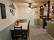 Cozy dining area with a table for four and built-in shelving at 1006 39Th W Ave, Bradenton, FL 34205