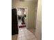 Hallway view looking into kitchen with stainless steel appliances and decorative tile floor at 1006 39Th W Ave, Bradenton, FL 34205