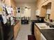 Bright kitchen features ample cabinetry and a view into the dining area at 1006 39Th W Ave, Bradenton, FL 34205