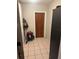An inside mudroom with a bin and a wooden door at 1006 39Th W Ave, Bradenton, FL 34205