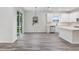 Bright dining room with wood-look floors and sliding glass doors at 2411 Orange Harvest Pl, Seffner, FL 33584